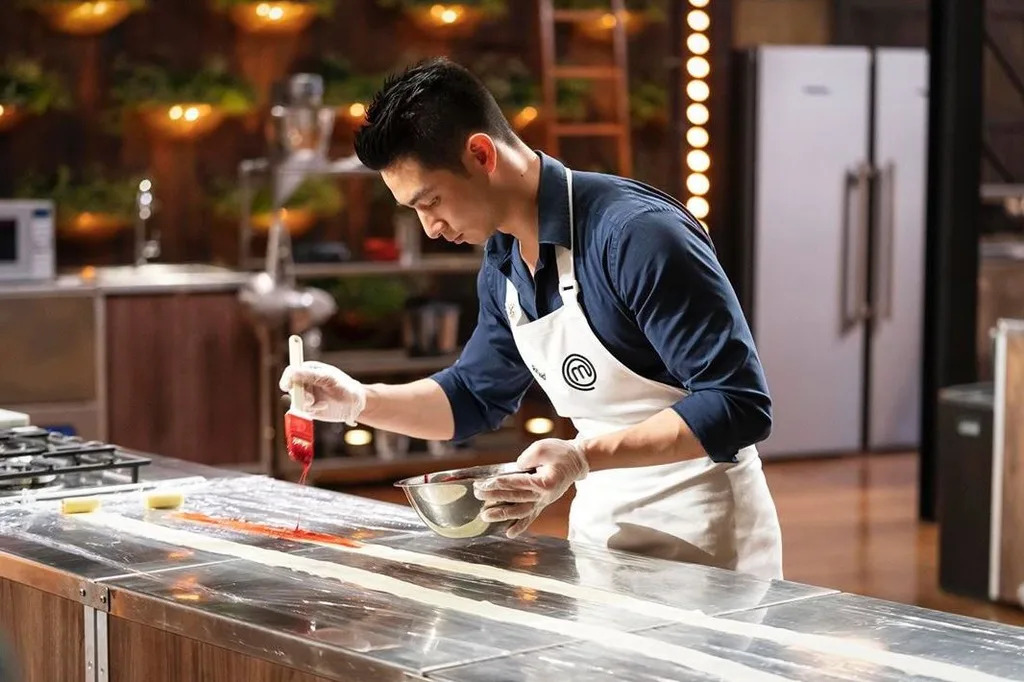 What MasterChef season was Reynold in? He's been on the show twice, plus a spin-off - image 1